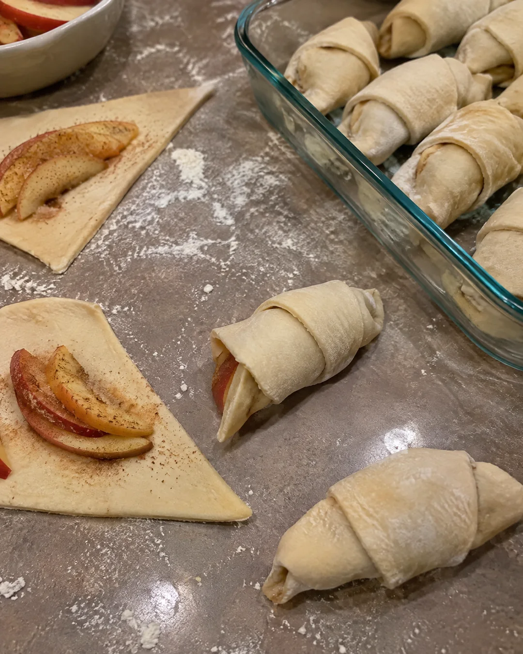Wrapping apple wedges in crescent roll dough triangles