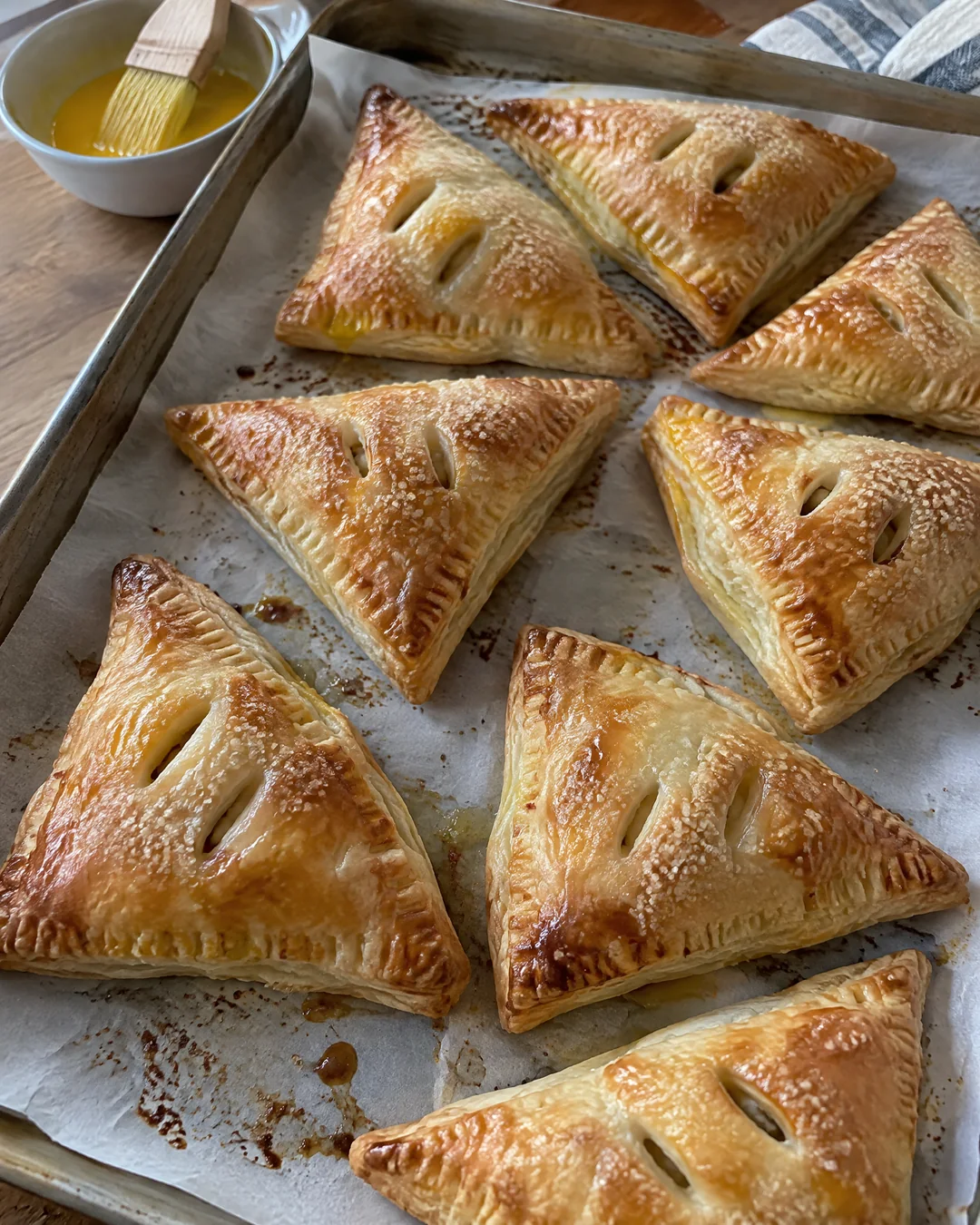 Sealed apple turnovers ready for the oven
