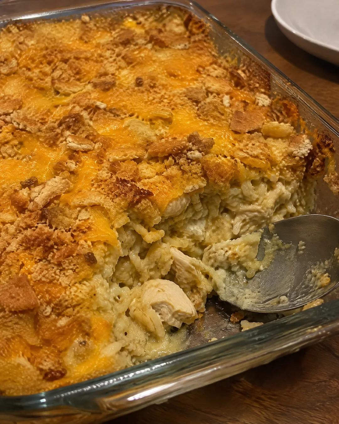 Baked chicken and rice casserole with a golden cheese and cracker top