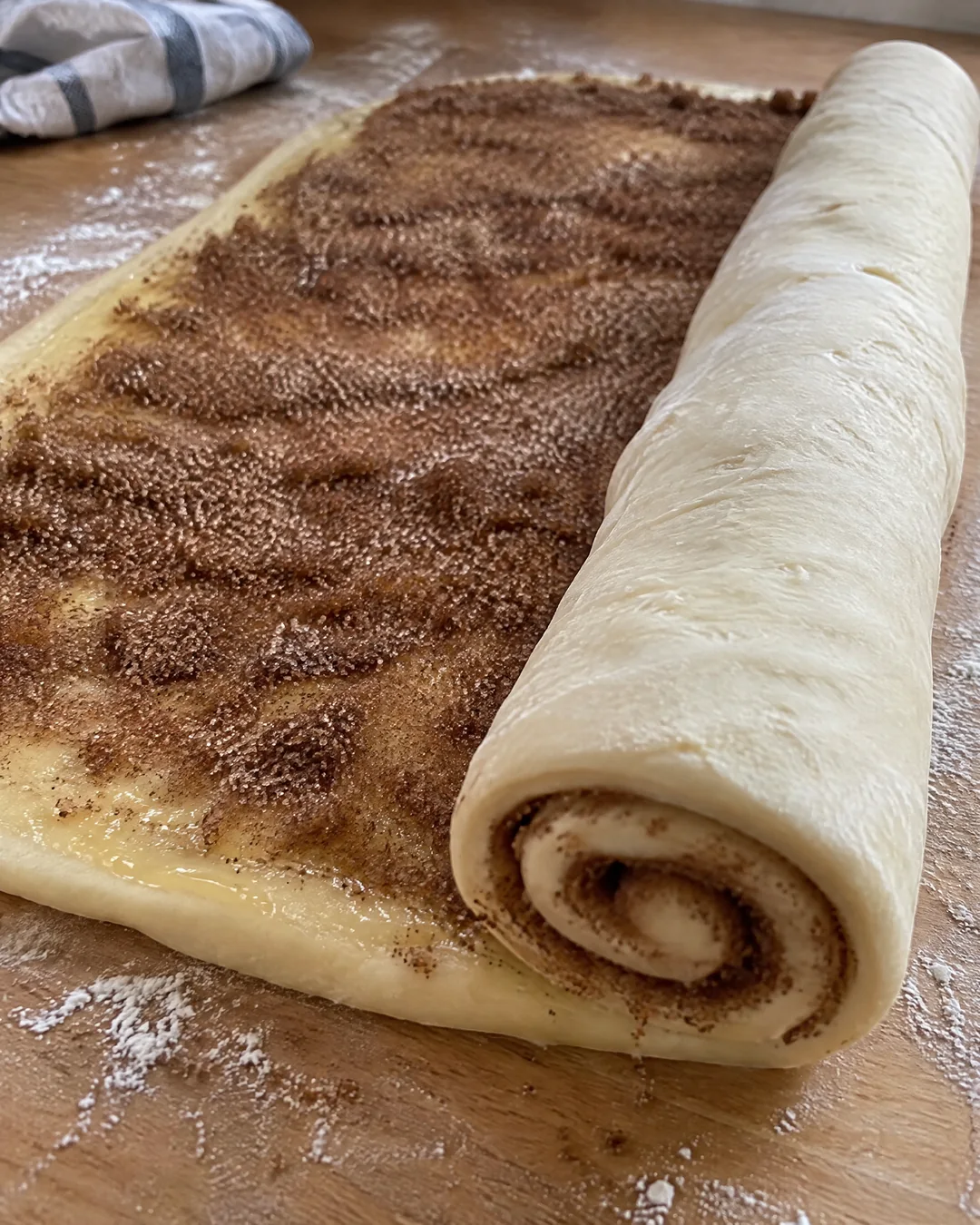 Rolling the cinnamon swirl dough tight