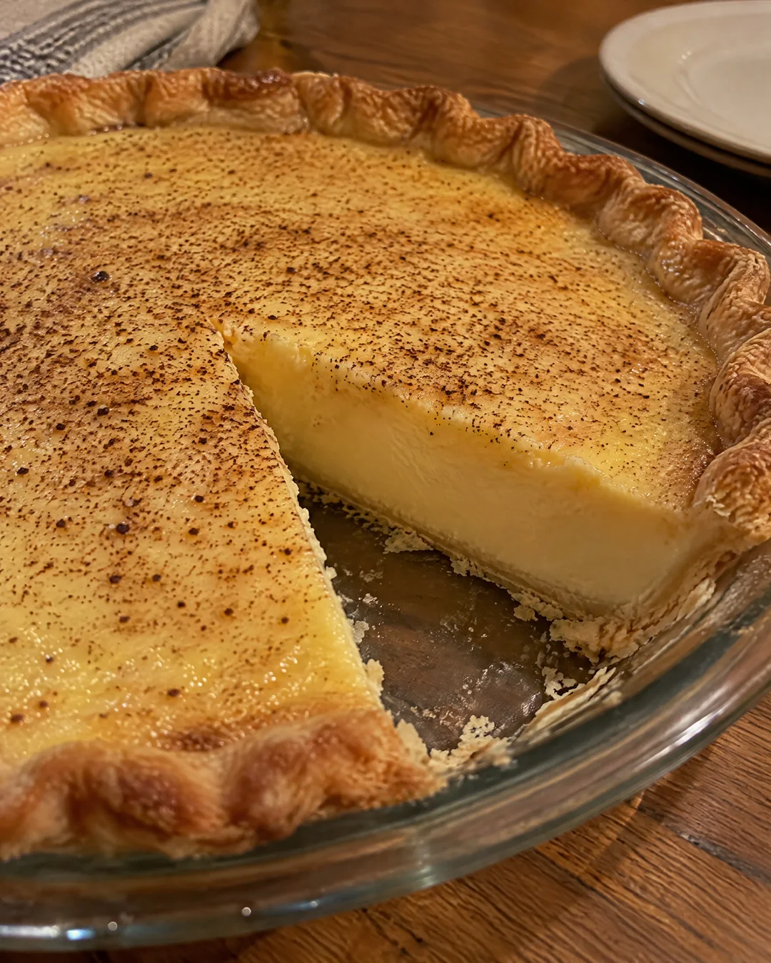 Whole egg custard pie freckled with nutmeg