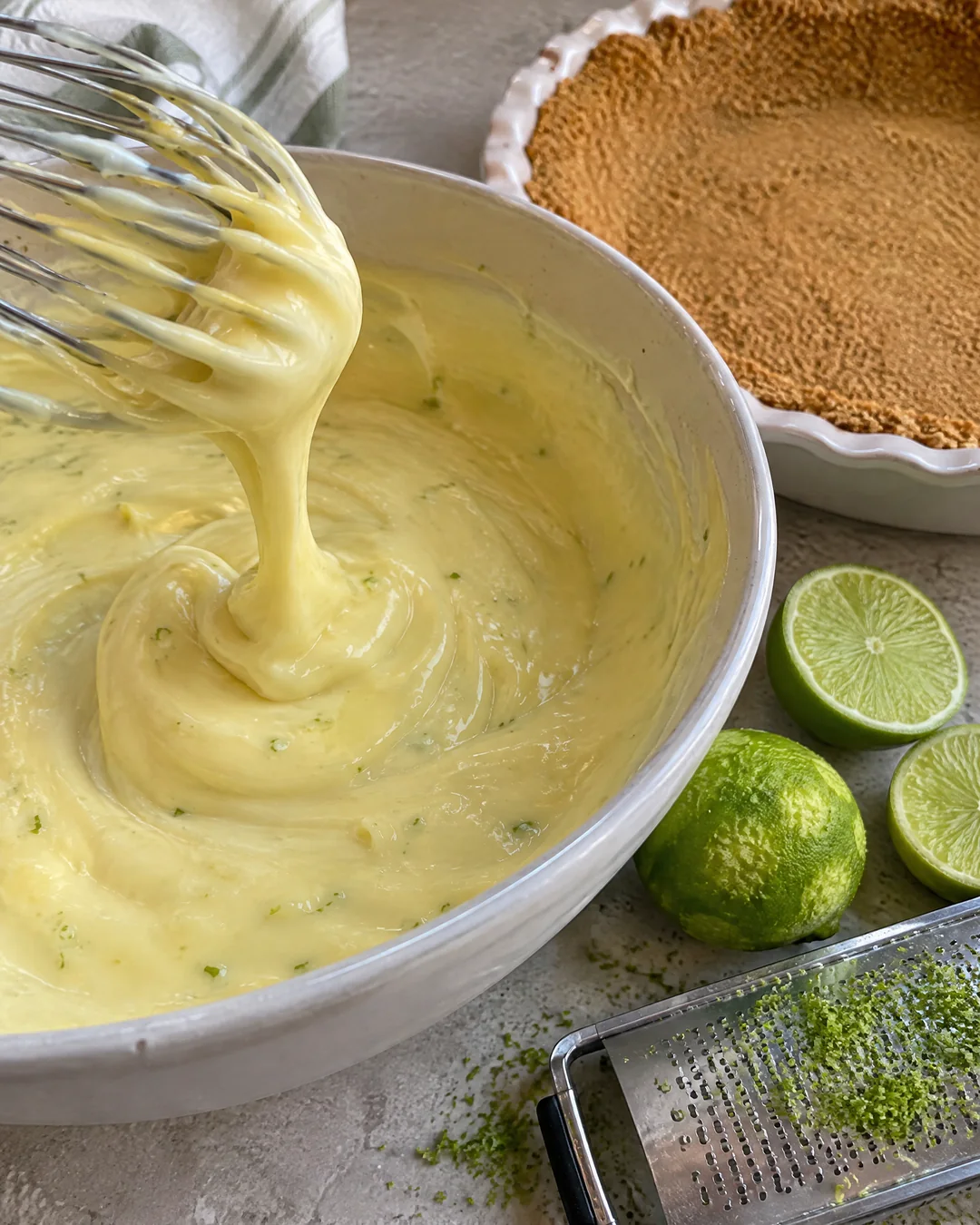 Creamy key lime filling being whisked in a bowl