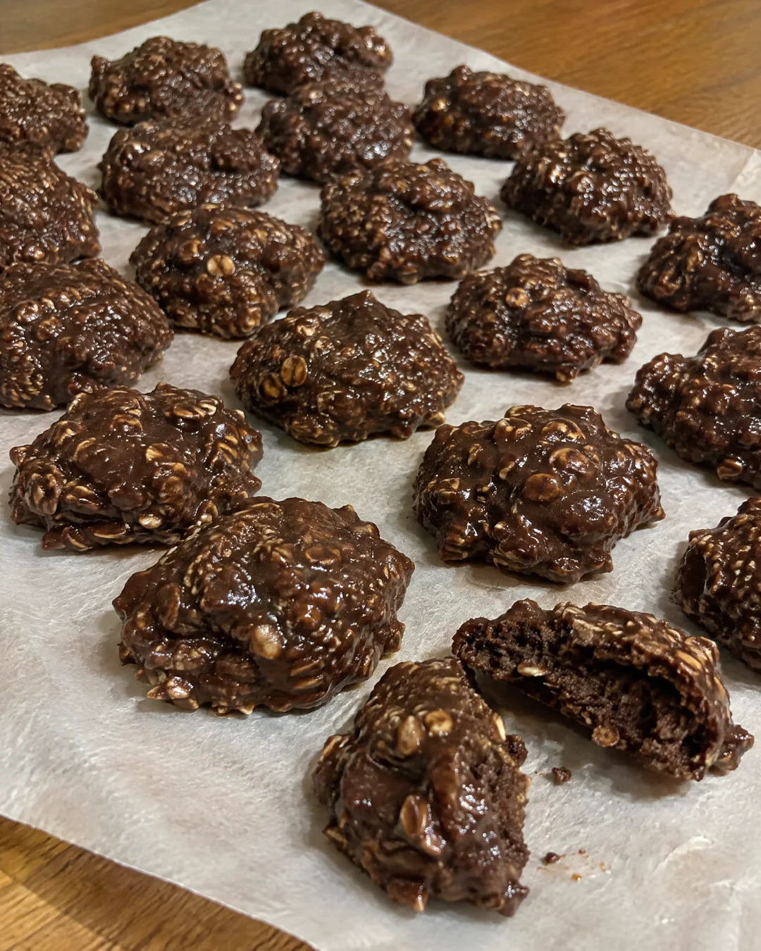 No-bake chocolate oatmeal cookies dropped on wax paper and setting